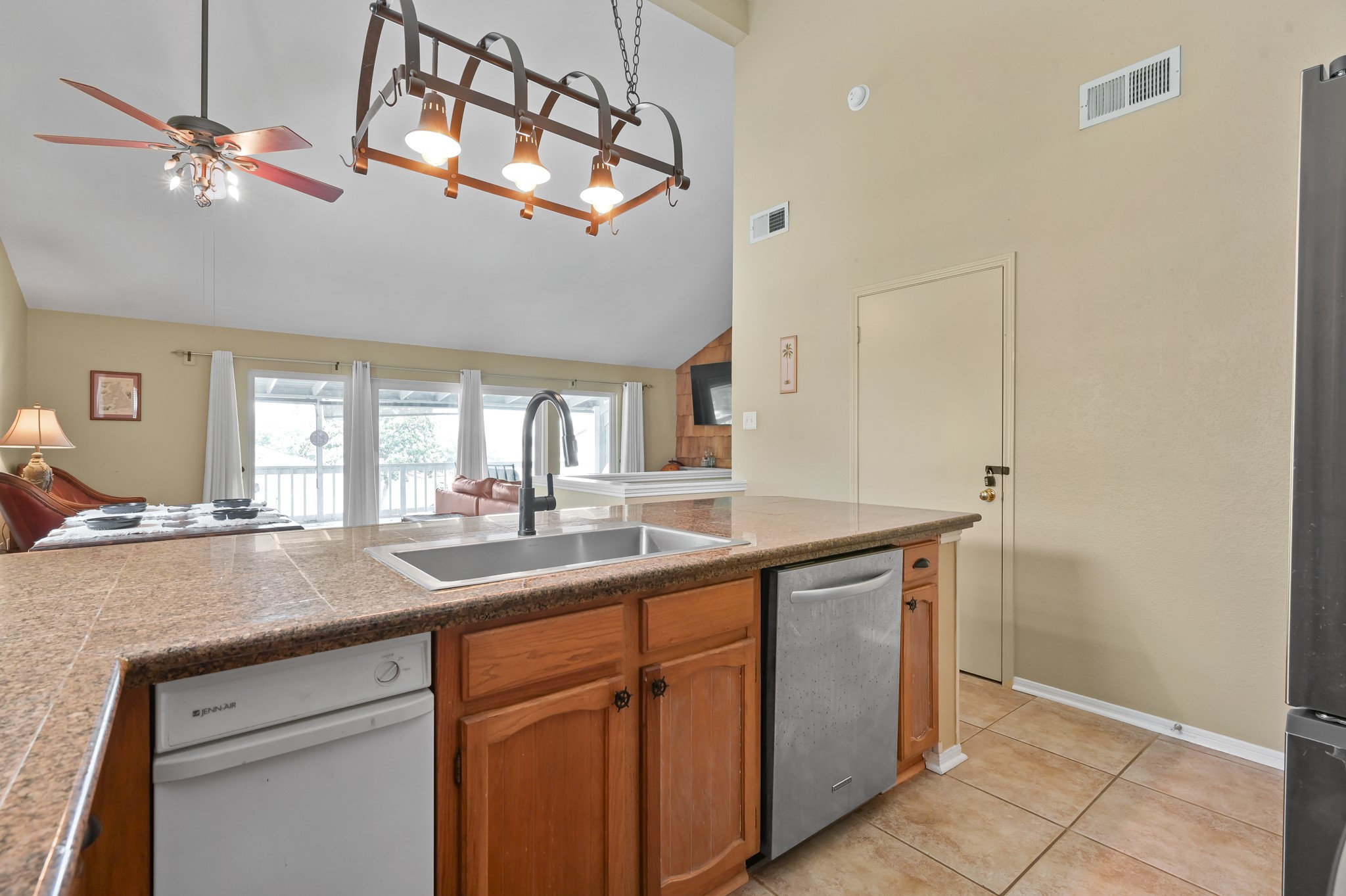 116 April Point Drive North Conroe, TX 77356 - Photo 34 of 44 a kitchen with a sink and a refrigerator