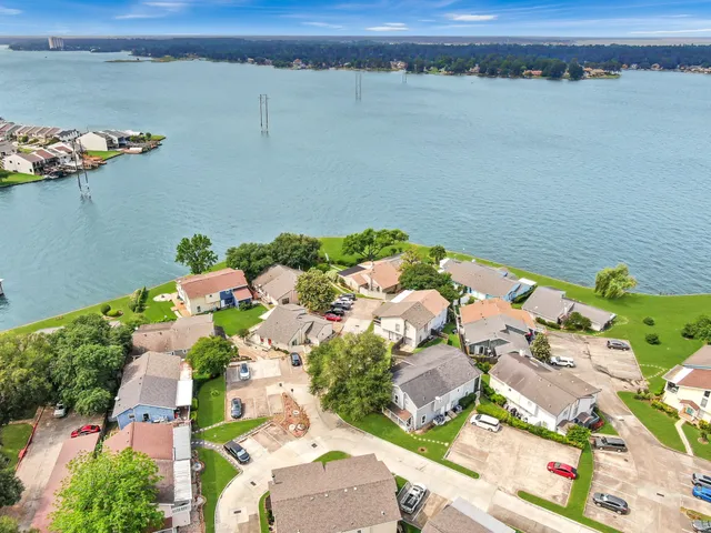 an aerial view of a house with a lake view