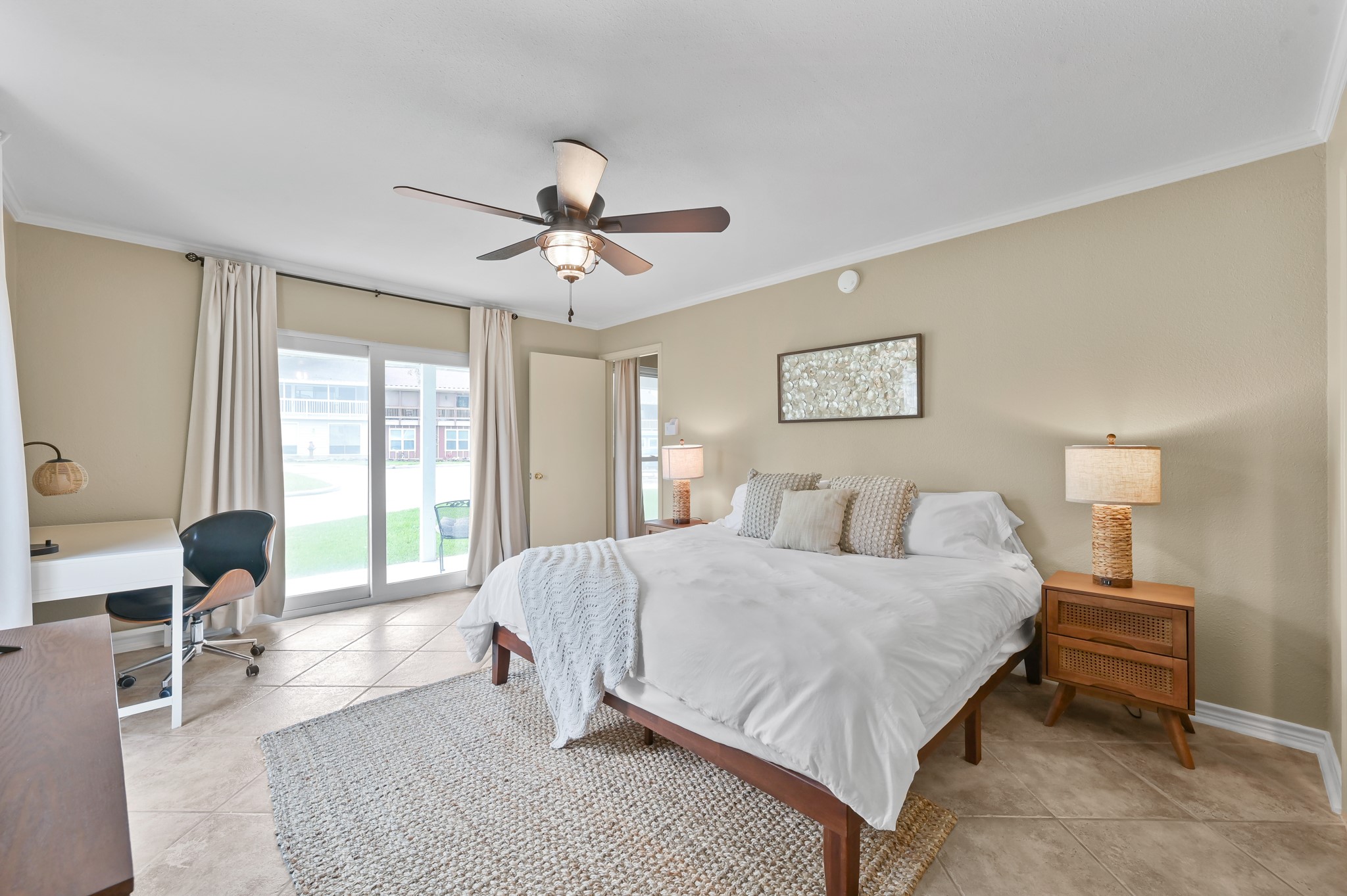 116 April Point Drive North Conroe, TX 77356 - Photo 7 of 44 a bedroom with a bed and a chandelier