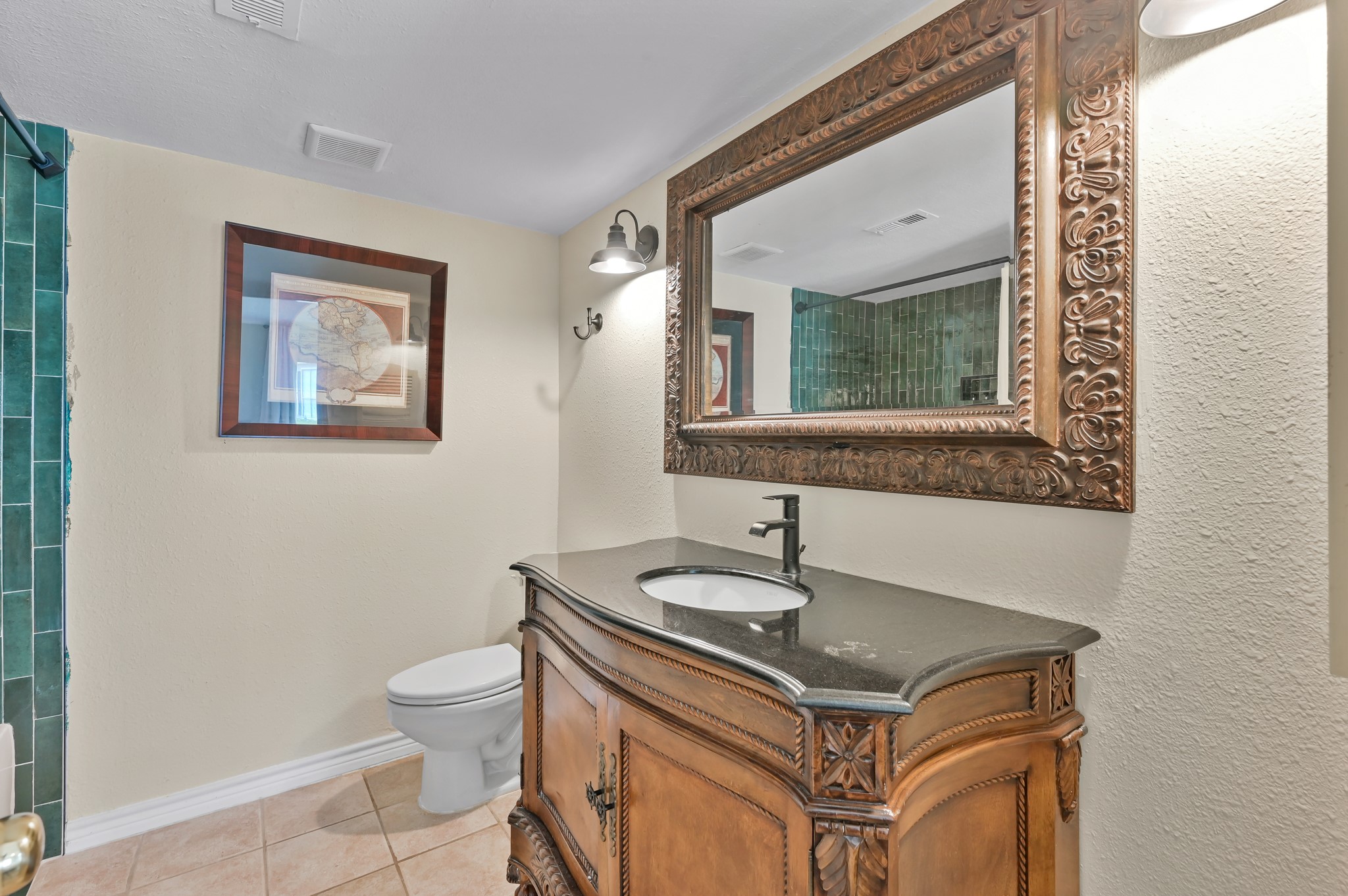 116 April Point Drive North Conroe, TX 77356 - Photo 9 of 44 a bathroom with a sink a toilet and mirror