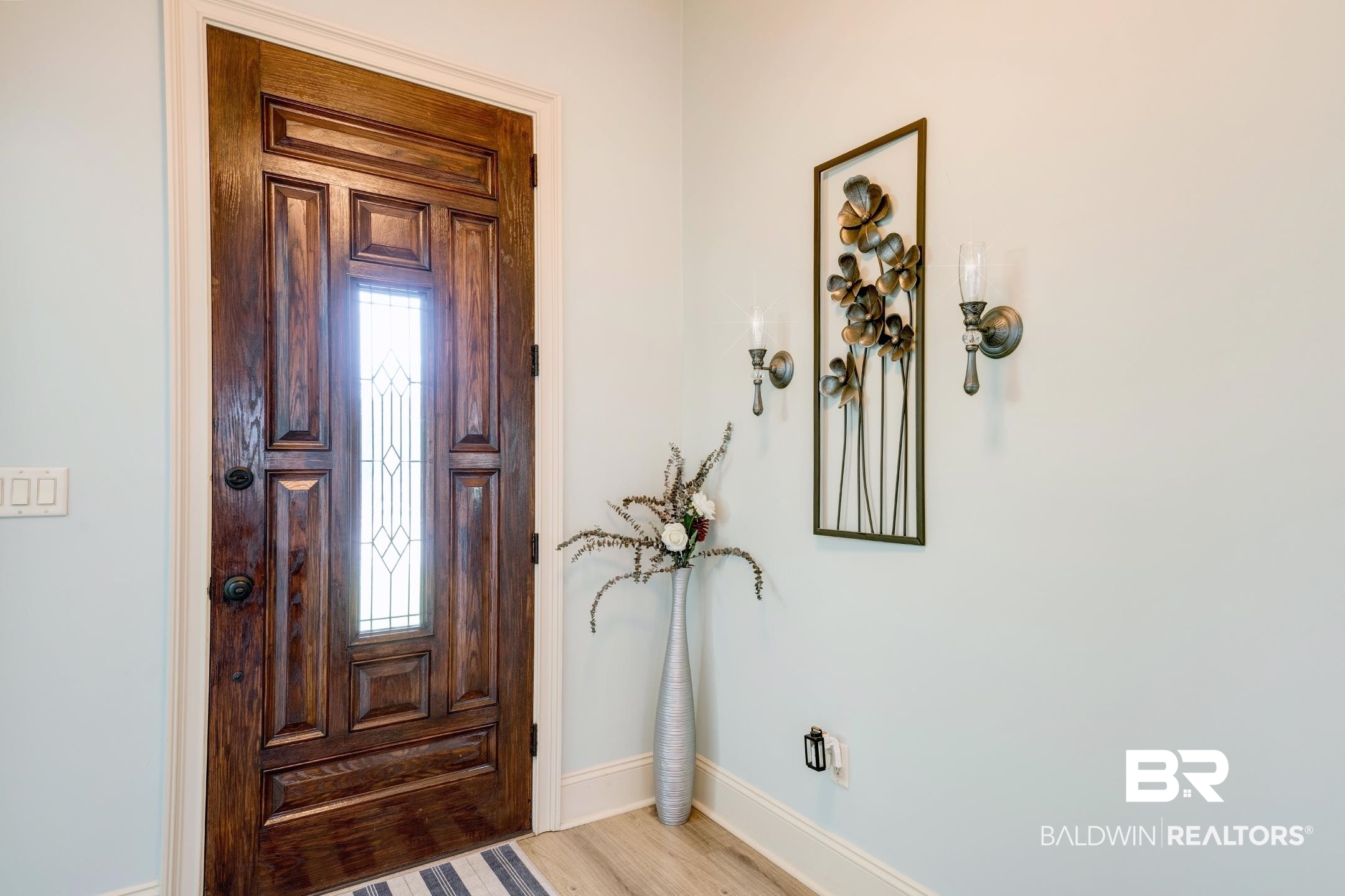 9357 Lakeview Drive Foley, AL 36535 - Photo 49 of 68 Paneled entry door with decorative glass inlay, framed by white trim