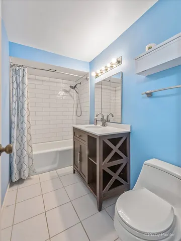 a bathroom with a sink a toilet and bathtub