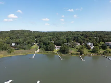 a view of a city street with a lake