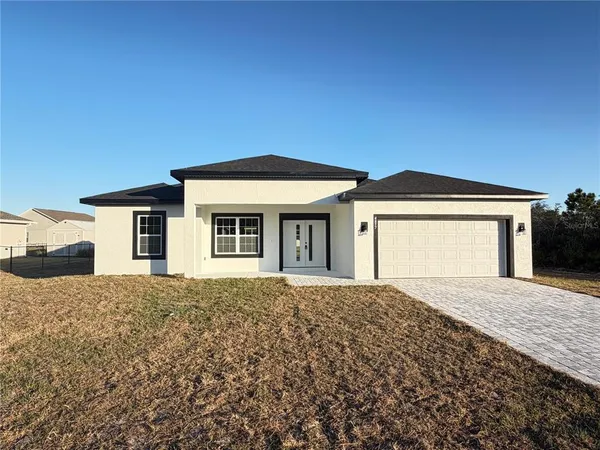 a front view of a house with a outdoor space
