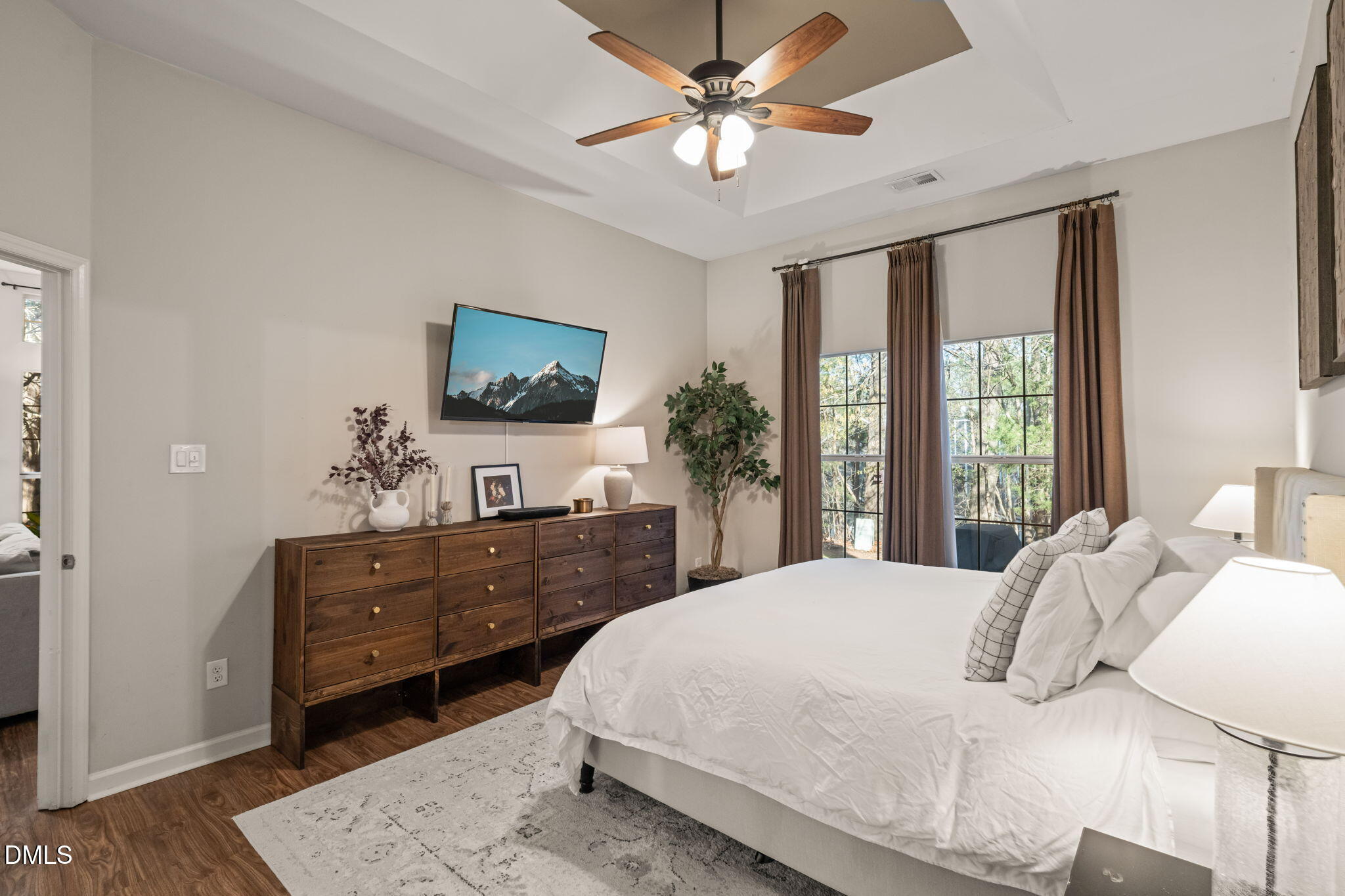 4601 Pine Trace Drive Raleigh, NC 27613 - Photo 11 of 38 a bedroom with a bed window and a dresser