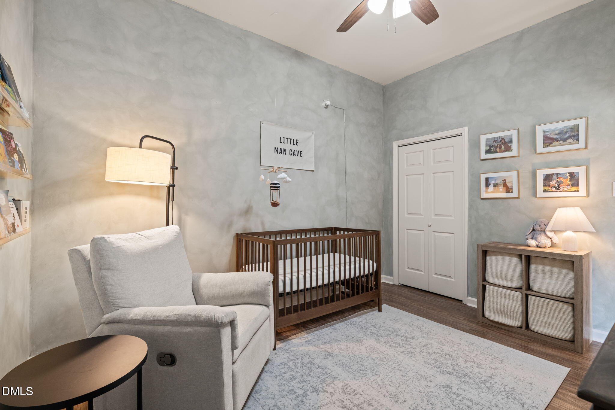 4601 Pine Trace Drive Raleigh, NC 27613 - Photo 16 of 38 a bedroom with a bed and a chandelier