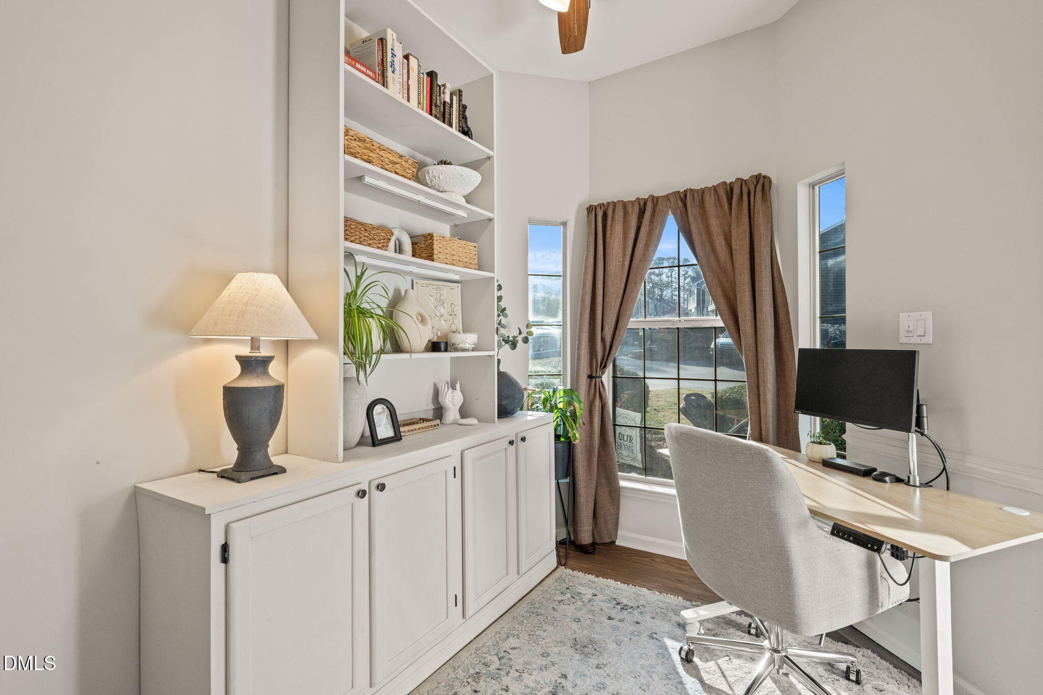 4601 Pine Trace Drive Raleigh, NC 27613 - Photo 21 of 38 a view of a workspace with furniture and a window