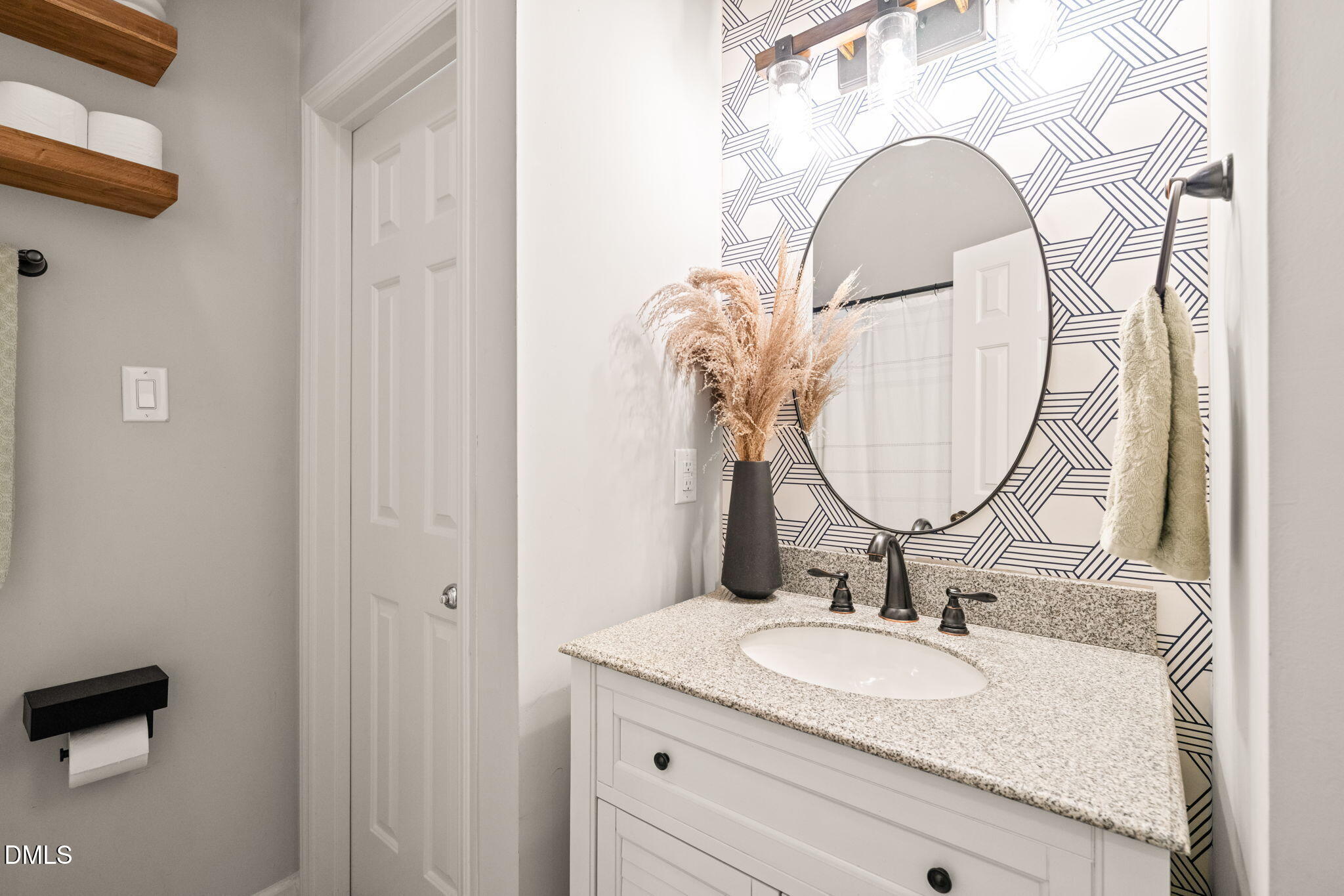 4601 Pine Trace Drive Raleigh, NC 27613 - Photo 24 of 38 a bathroom with a granite countertop sink mirror and vanity