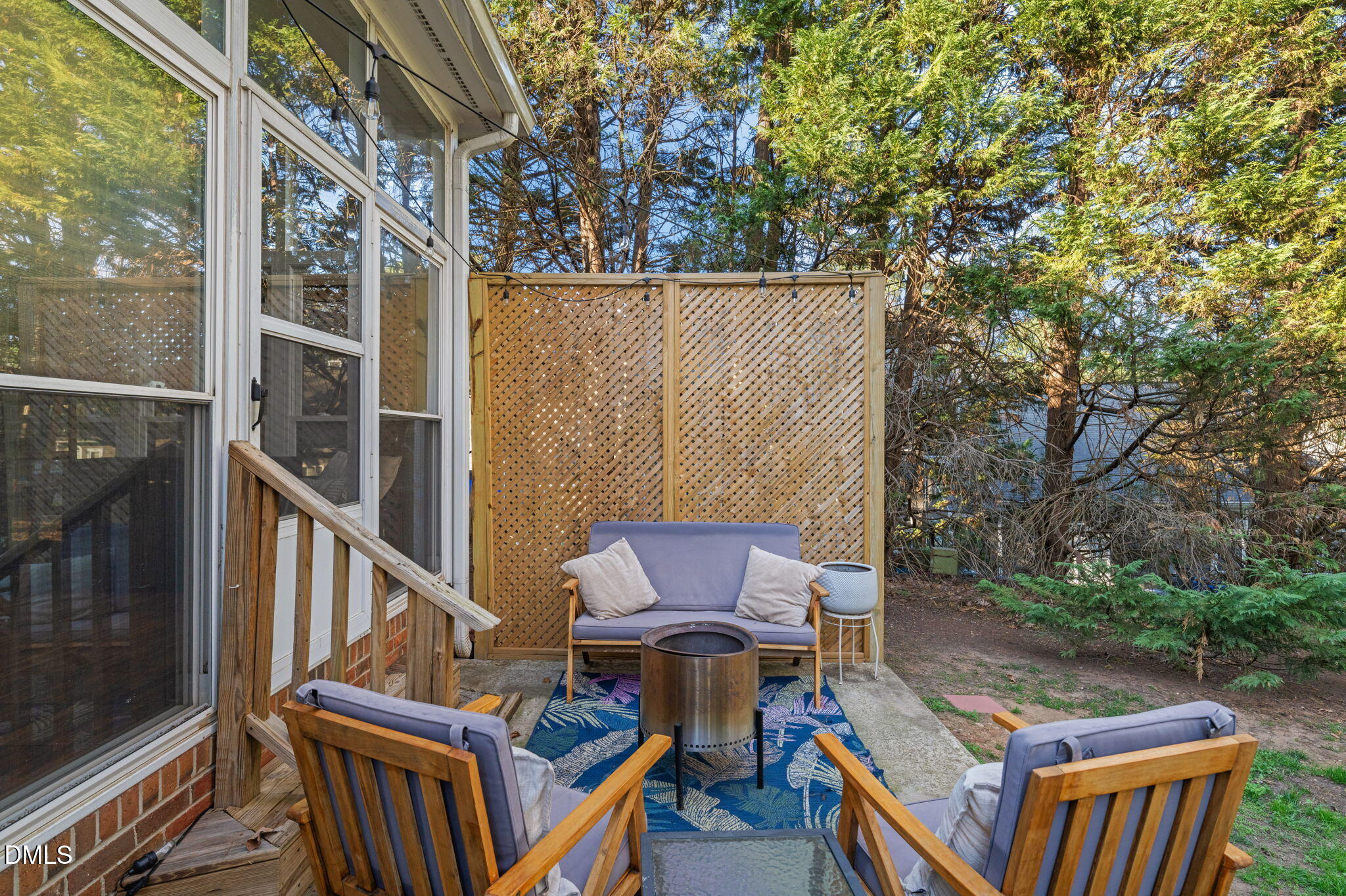 4601 Pine Trace Drive Raleigh, NC 27613 - Photo 31 of 38 a view of an outdoor sitting area with brick walls