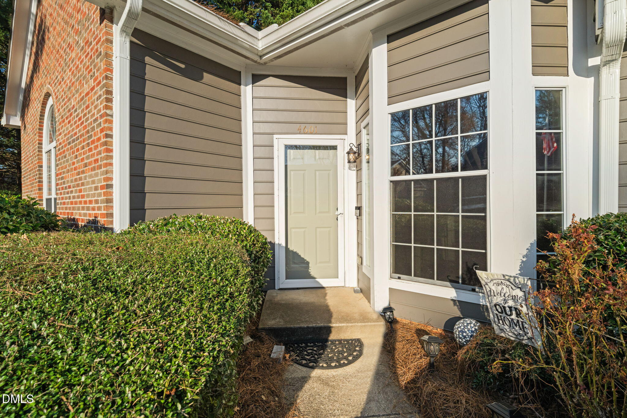 4601 Pine Trace Drive Raleigh, NC 27613 - Photo 36 of 38 a front view of a house with a garden