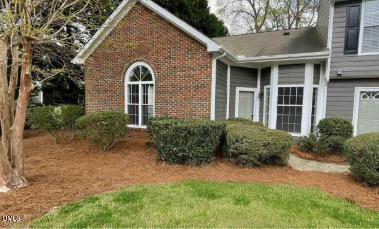 4601 Pine Trace Drive Raleigh, NC 27613 - Photo 38 of 38 a front view of a house with garden
