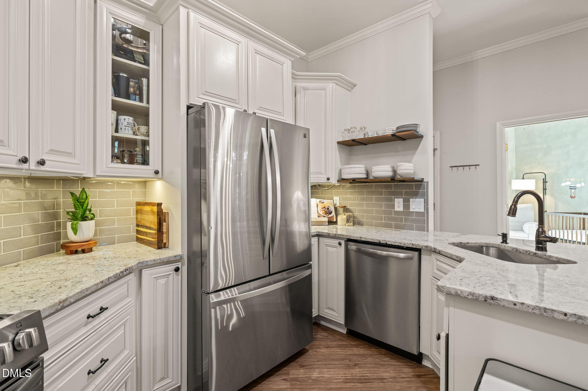 4601 Pine Trace Drive Raleigh, NC 27613 - Photo 5 of 38 a kitchen with stainless steel appliances granite countertop a refrigerator sink and stove