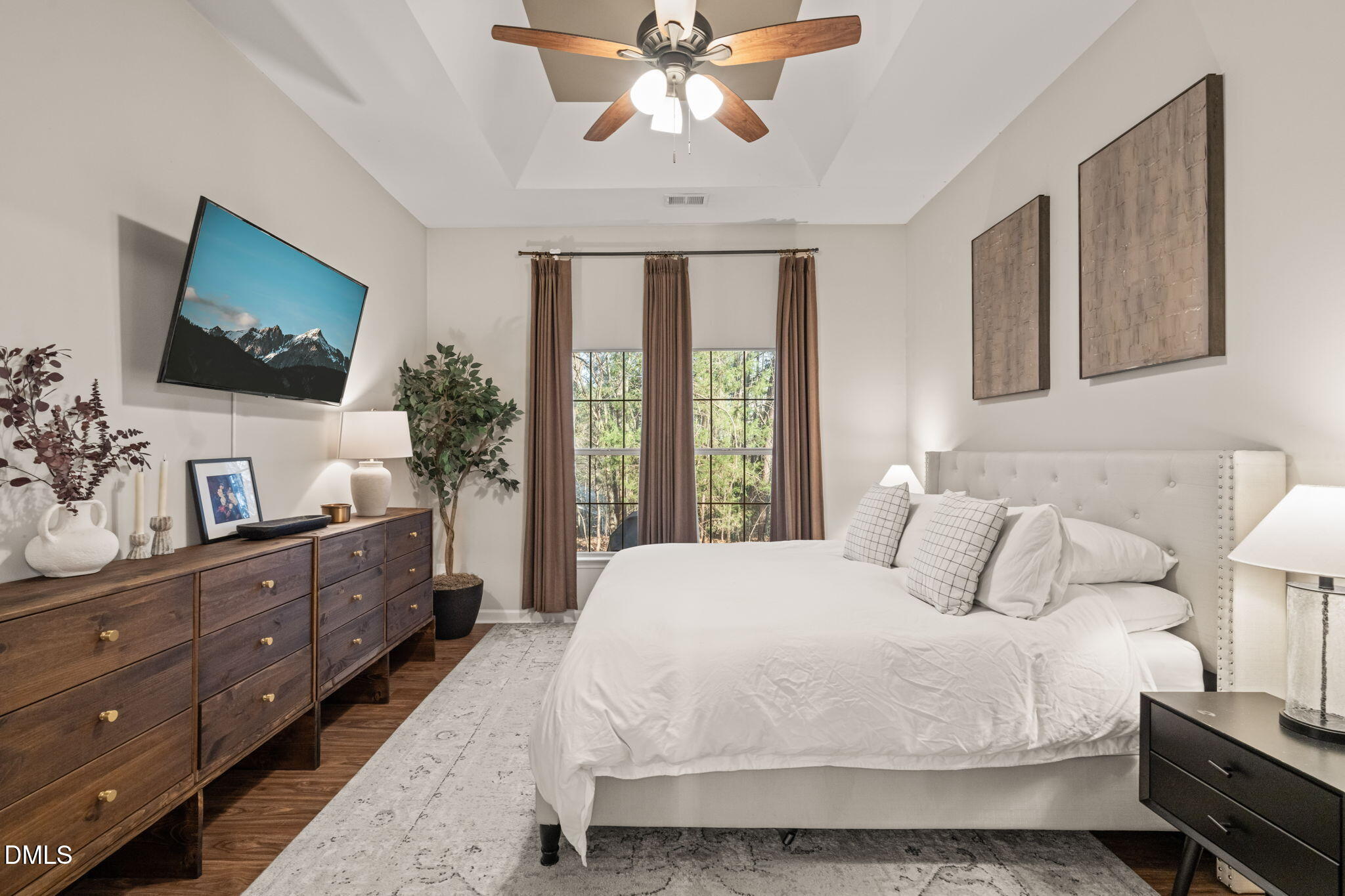 4601 Pine Trace Drive Raleigh, NC 27613 - Photo 10 of 38 a spacious bedroom with a large bed and a flat screen tv