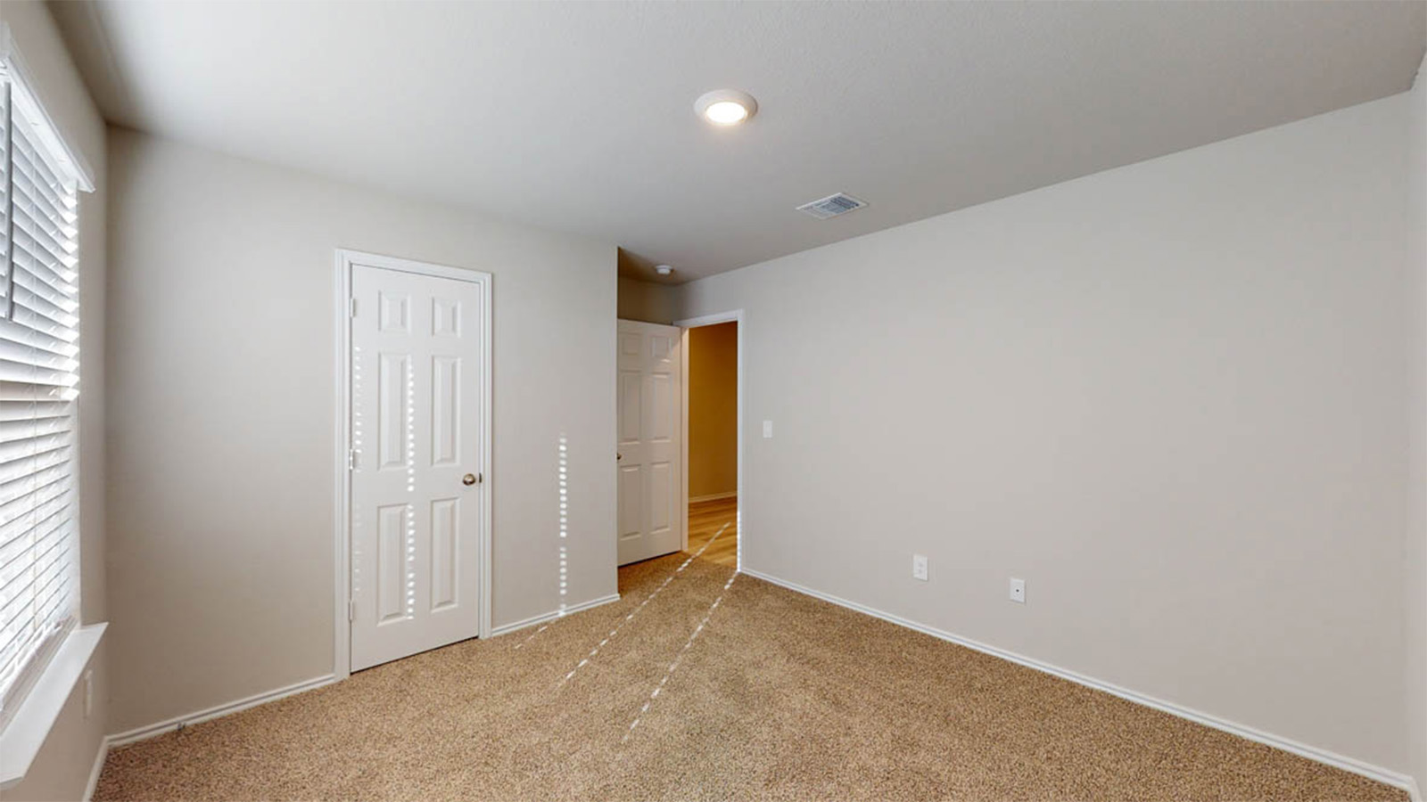 1407 Victory Rnch Trail Killeen, TX 76549 - Photo 16 of 24 A well-lit bedroom features plush carpeting and convenient entryways.