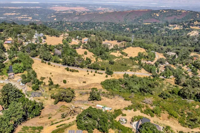 an aerial view of a houses with yard