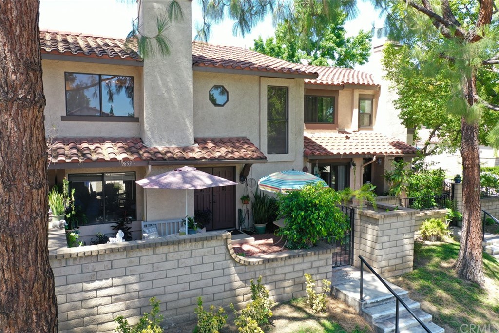 9853 Madera Court Rancho Cucamonga, CA 91730 - Photo 1 of 1 a front view of a house with patio