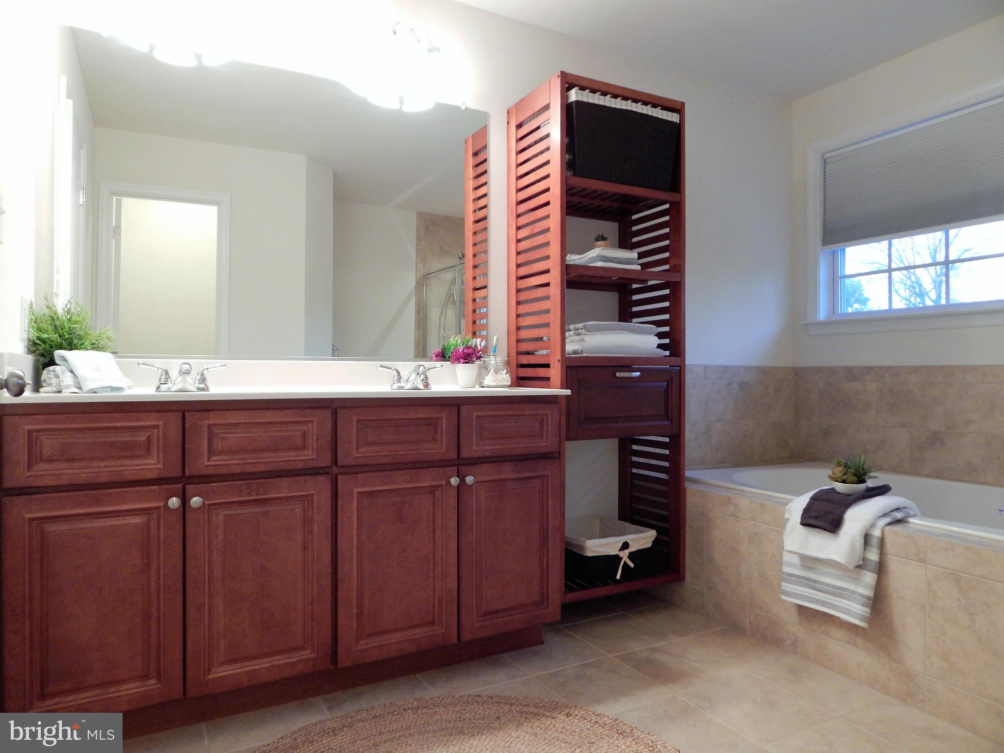 8254 Quarterfield Road Severn, MD 21144 - Photo 15 of 30 a bathroom with a sink and a mirror