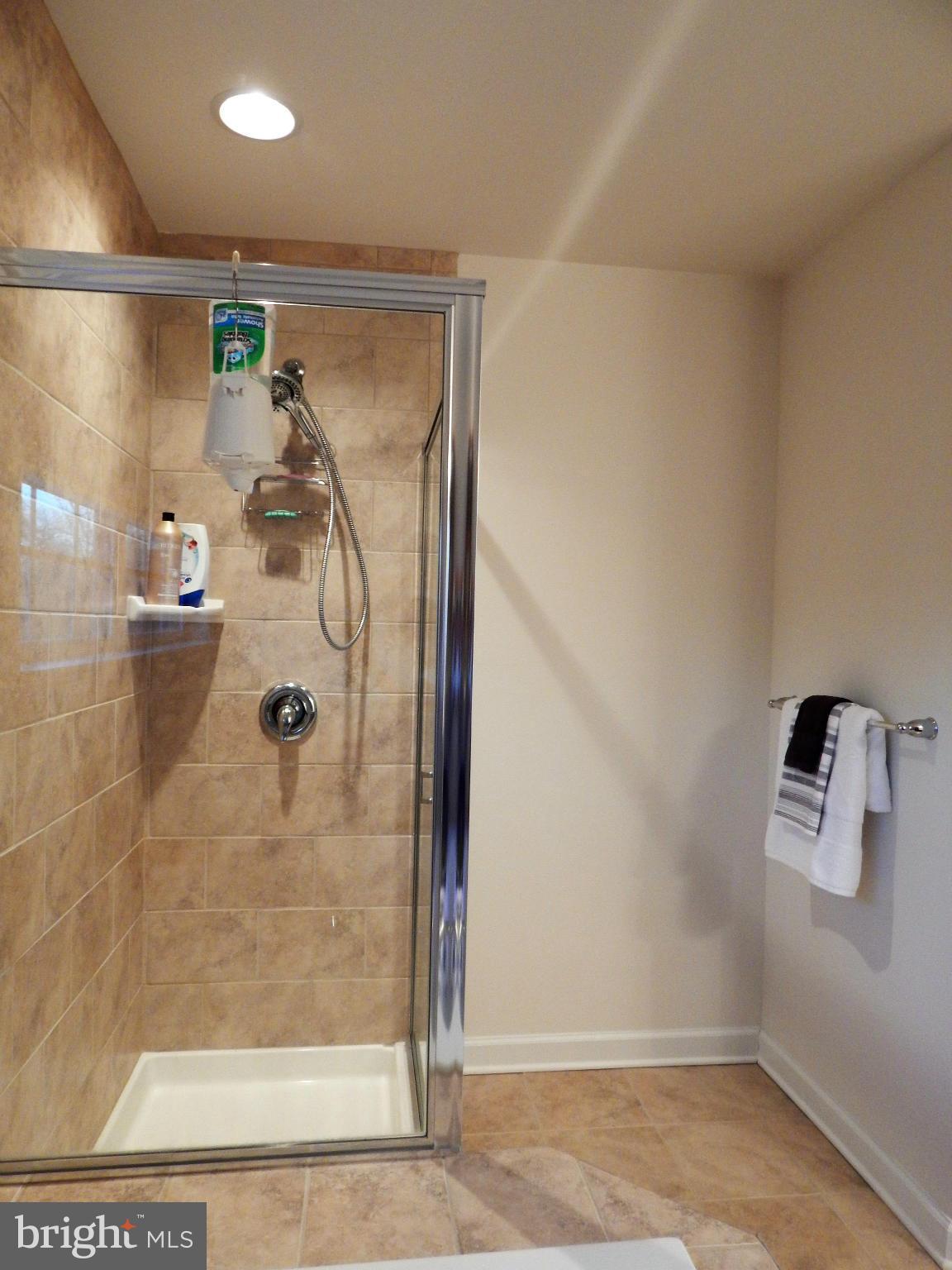 8254 Quarterfield Road Severn, MD 21144 - Photo 19 of 30 a bathroom with a shower