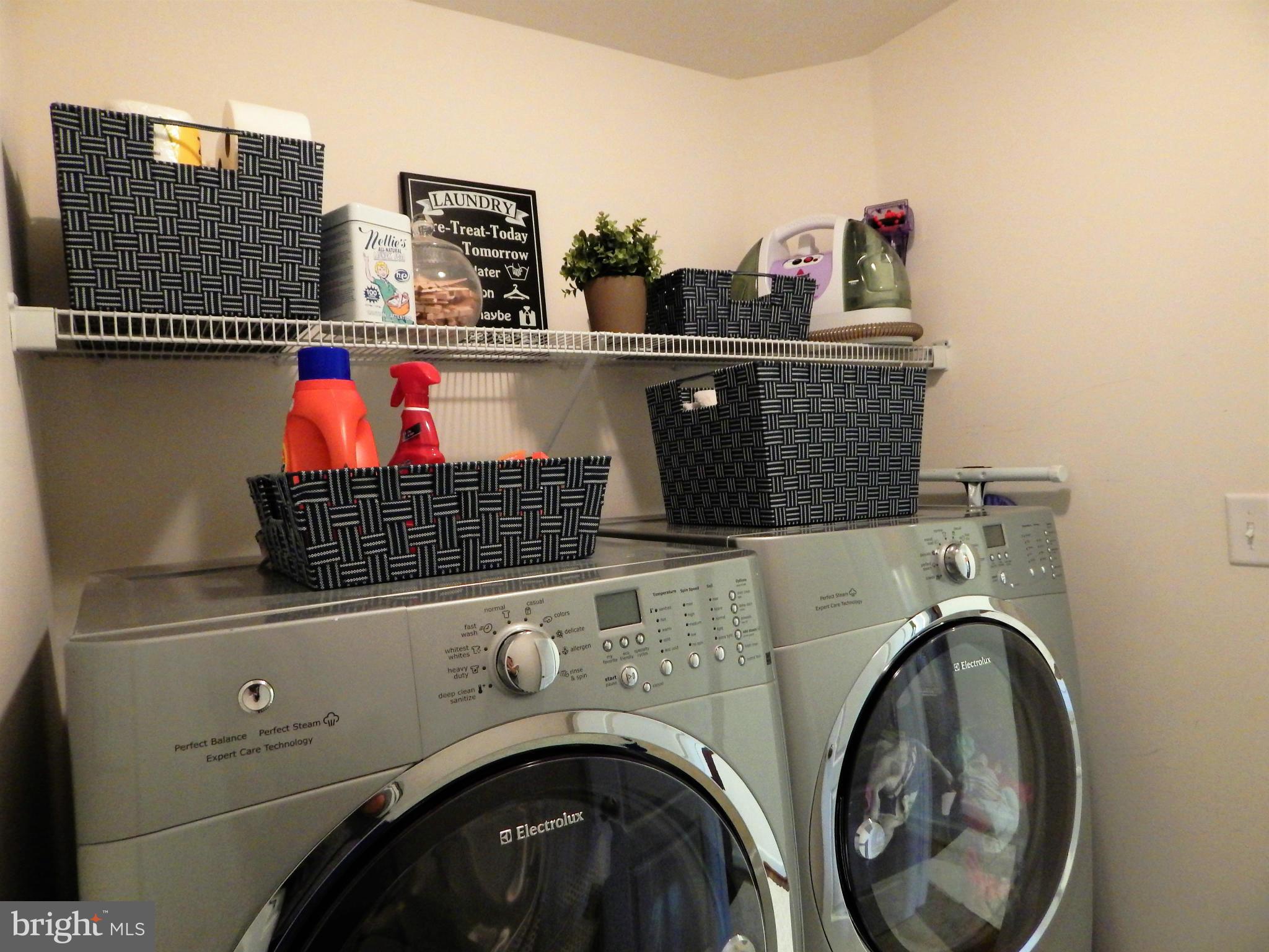 8254 Quarterfield Road Severn, MD 21144 - Photo 24 of 30 a utility room with dryer and washer