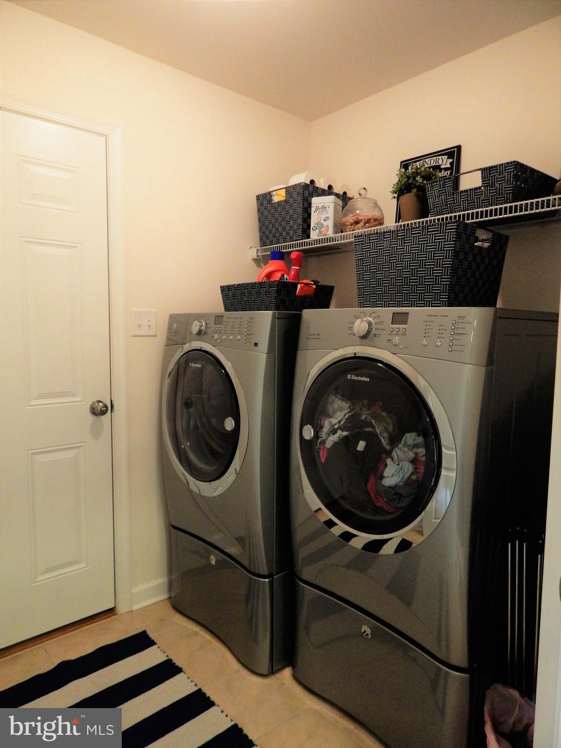 8254 Quarterfield Road Severn, MD 21144 - Photo 25 of 30 a utility room with dryer and washer