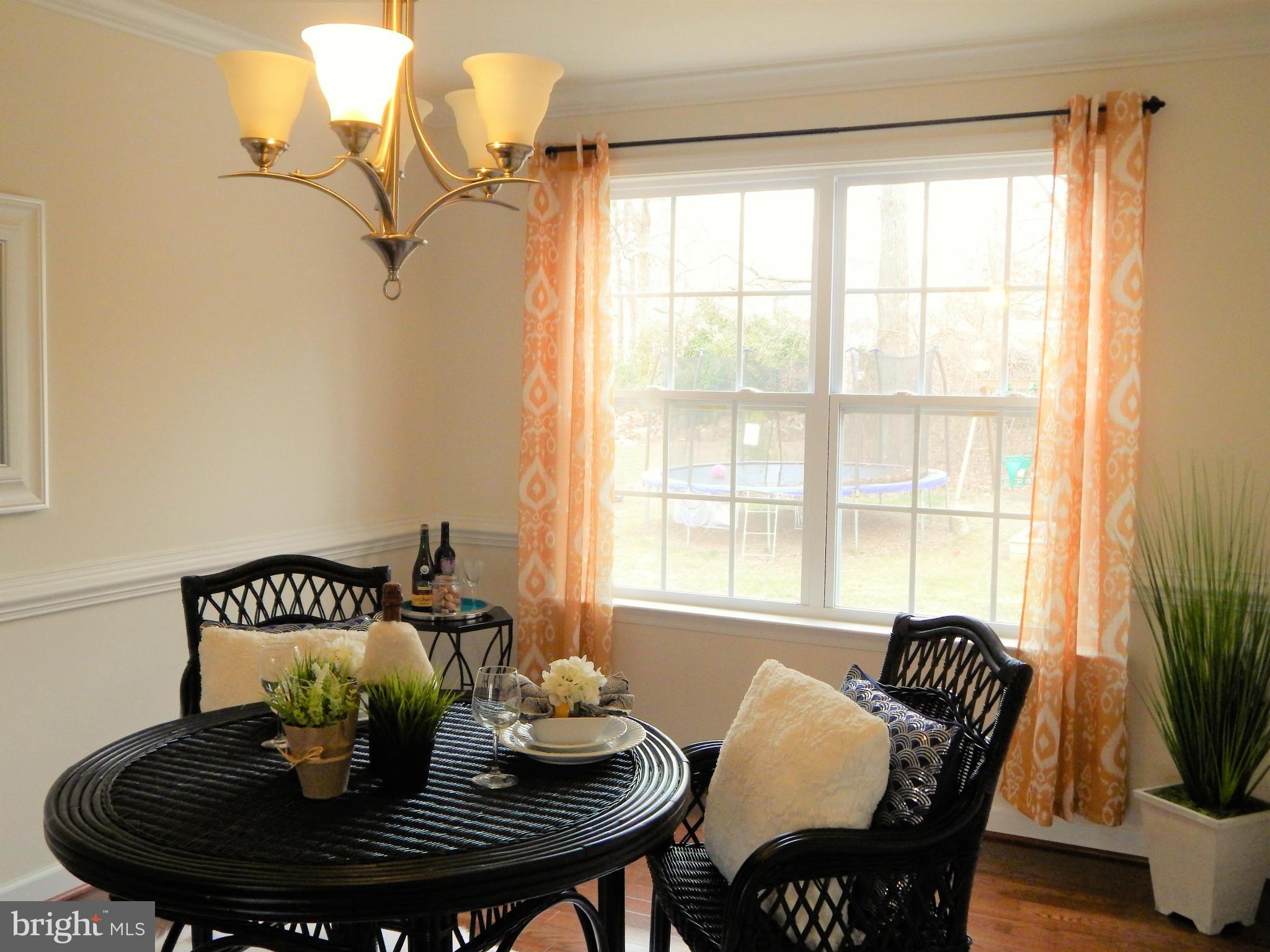 8254 Quarterfield Road Severn, MD 21144 - Photo 9 of 30 a dining room with furniture and window