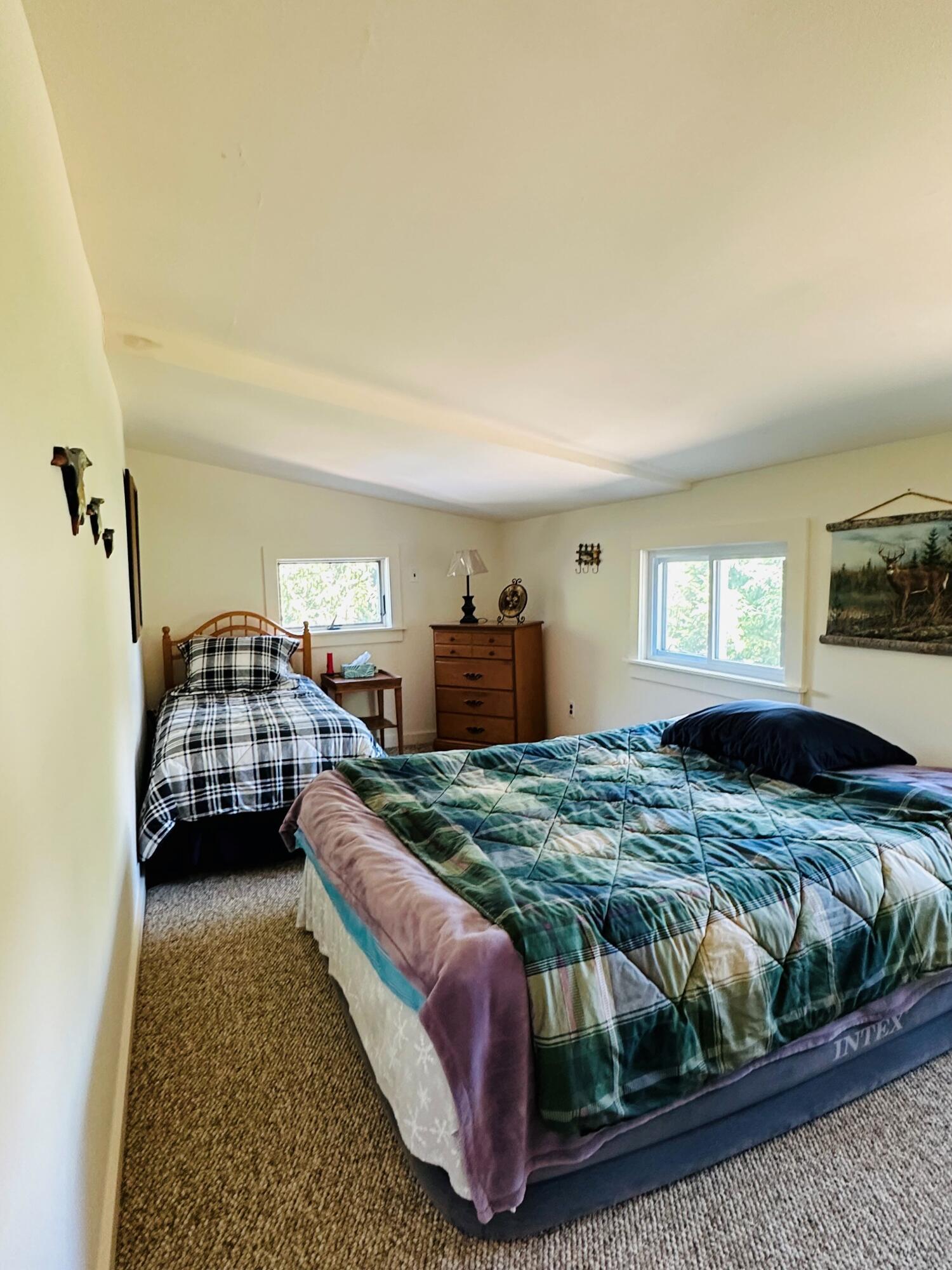 139 Pecks Pond Road Dingmans Ferry, PA 18328 - Photo 12 of 26 a bedroom with a bed and window