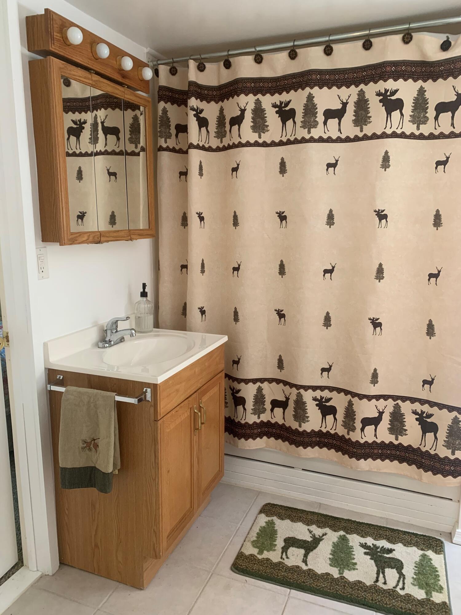 139 Pecks Pond Road Dingmans Ferry, PA 18328 - Photo 15 of 26 a utility room with stainless steel appliances granite countertop a stove and a sink