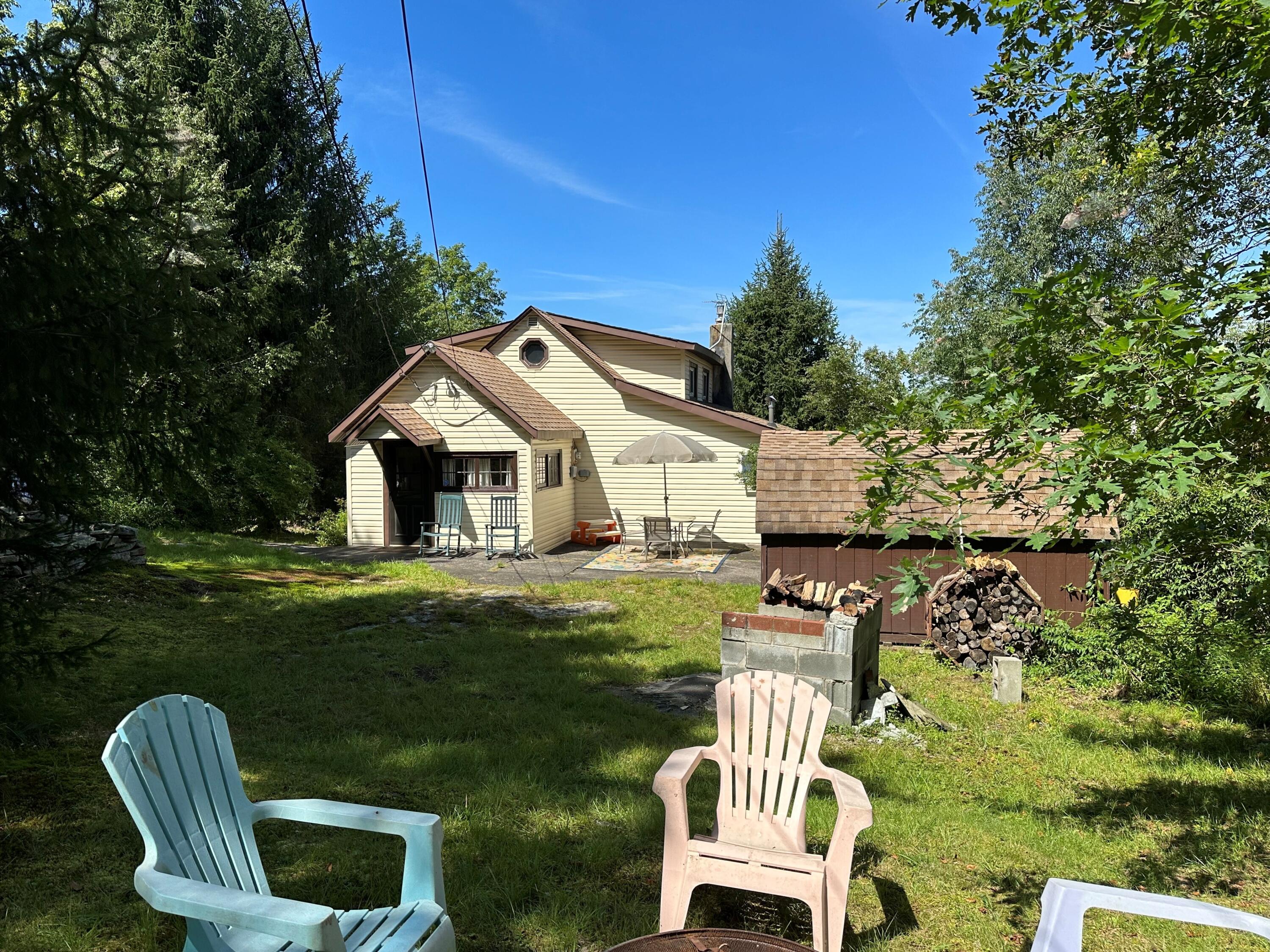 139 Pecks Pond Road Dingmans Ferry, PA 18328 - Photo 23 of 26 a front view of a house with garden