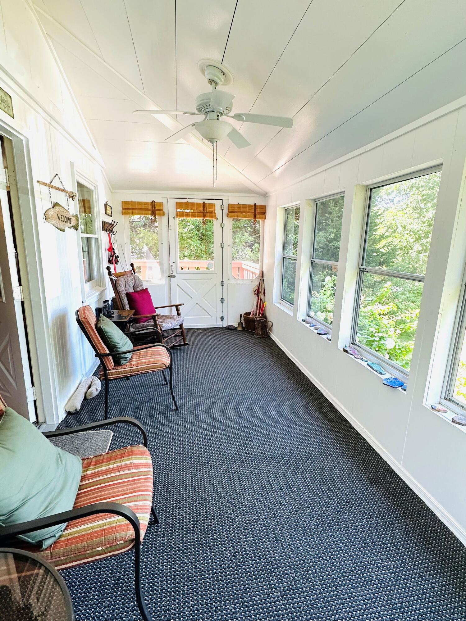 139 Pecks Pond Road Dingmans Ferry, PA 18328 - Photo 3 of 26 a living room with furniture and a large window