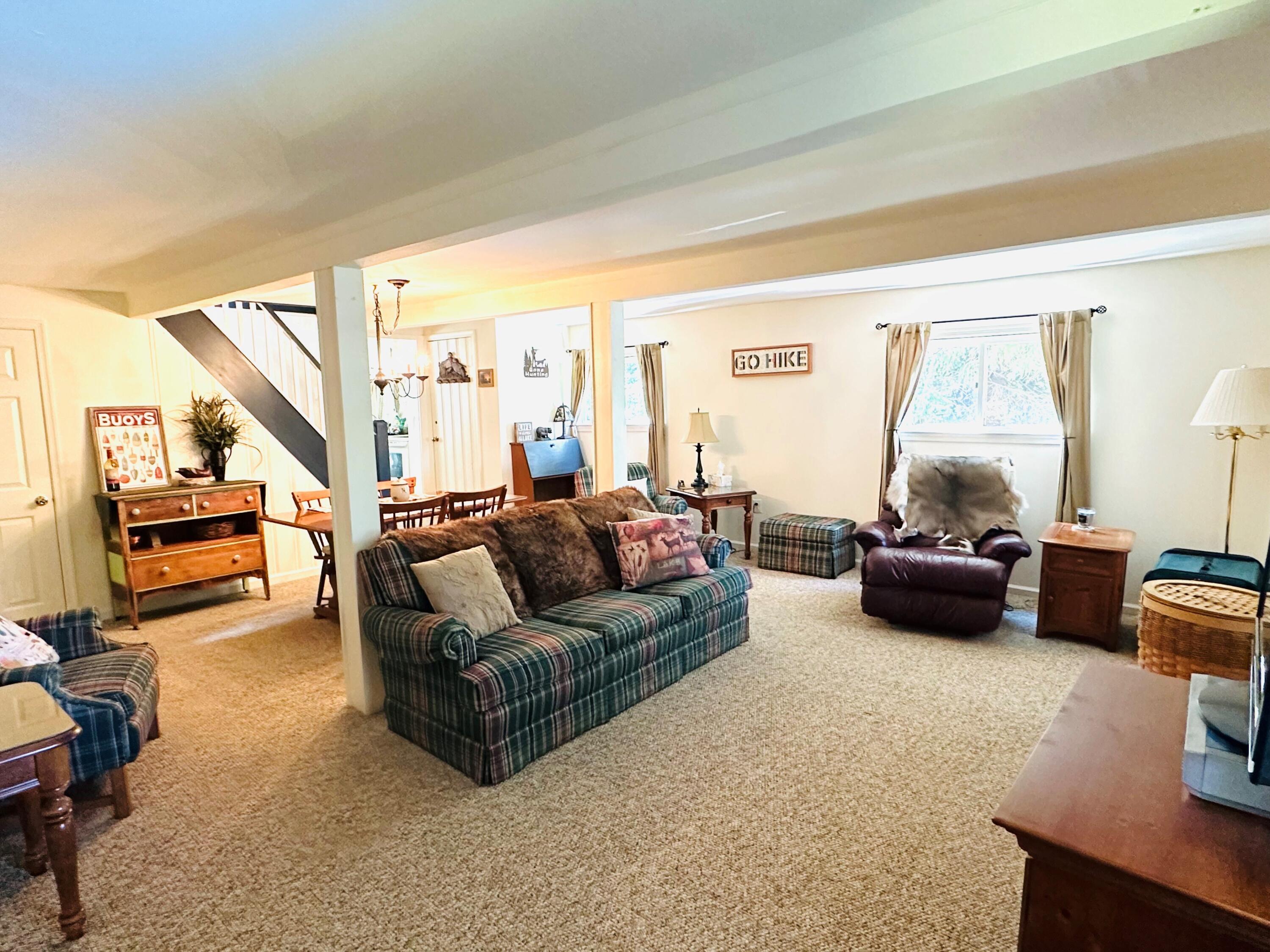 139 Pecks Pond Road Dingmans Ferry, PA 18328 - Photo 4 of 26 a living room with furniture and a large window
