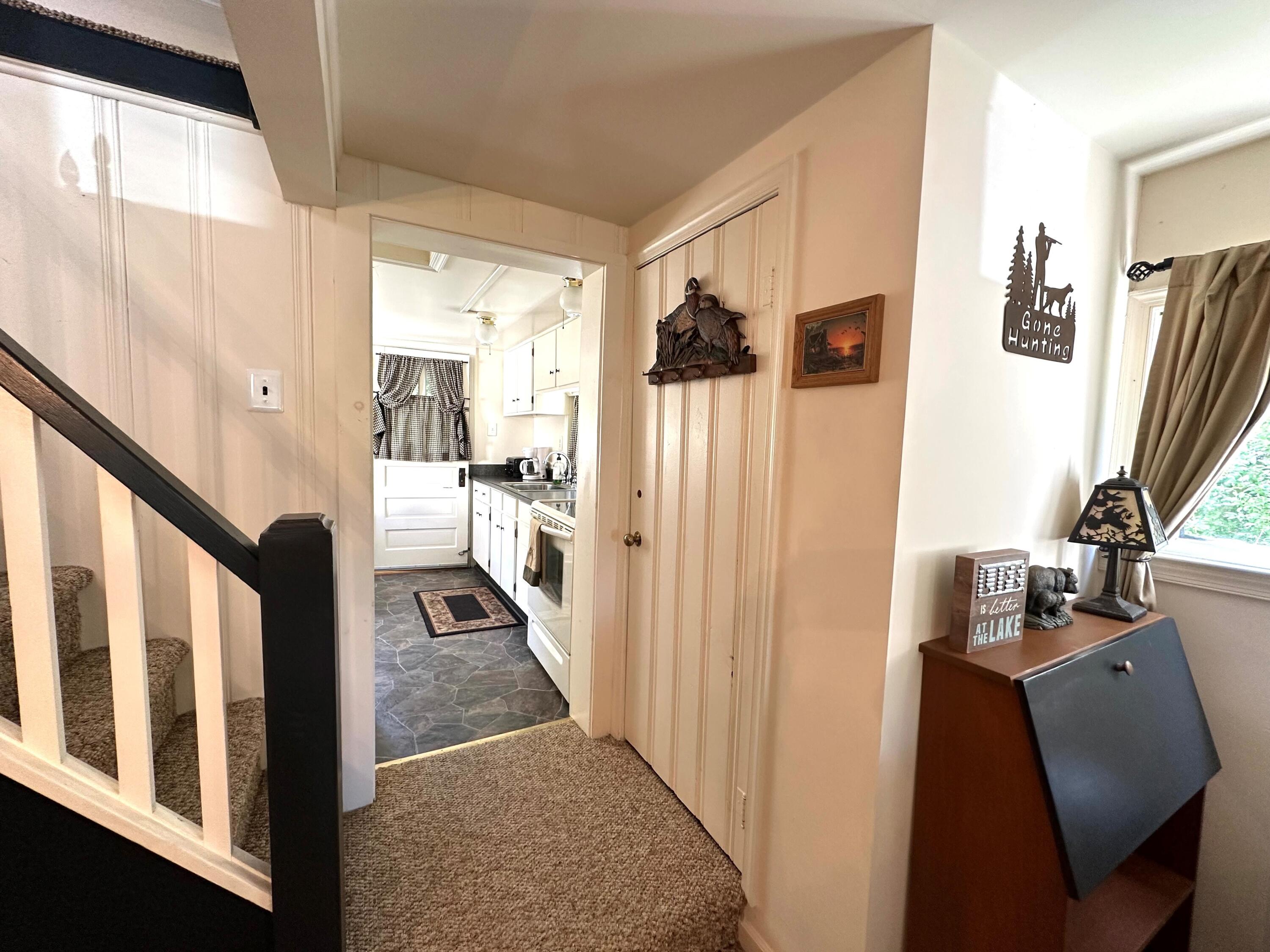 139 Pecks Pond Road Dingmans Ferry, PA 18328 - Photo 7 of 26 a view of a hallway with living room