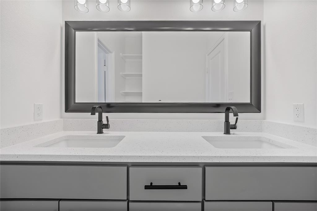 3093 Willow Road Celeste, TX 75423 - Photo 35 of 40 a bathroom with a sink and a mirror