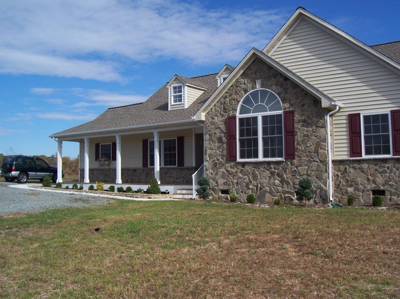 3852 Hatchett Road Penhook, VA 24137 - Photo 1 of 13 a front view of a house with outdoor seating