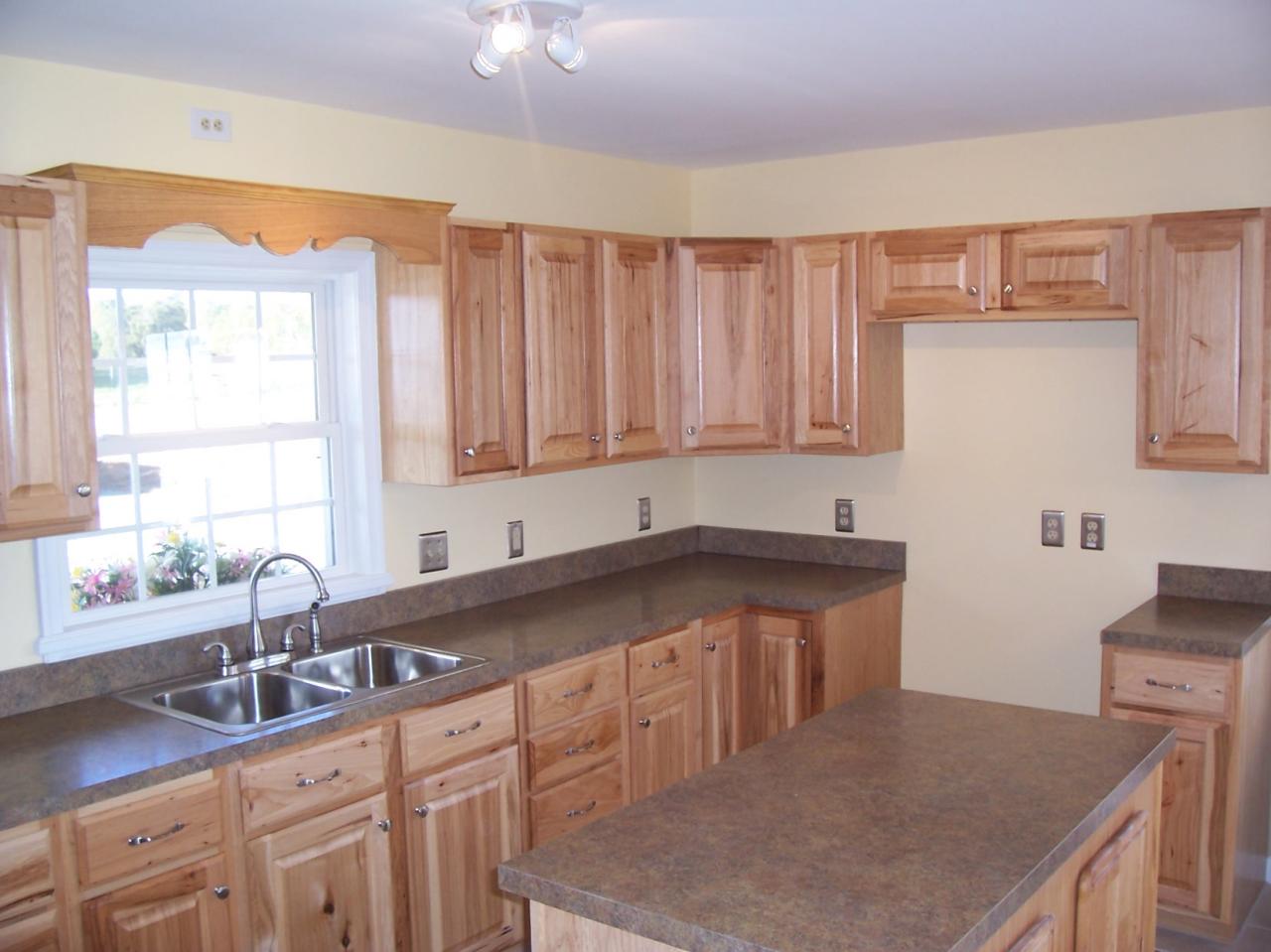 3852 Hatchett Road Penhook, VA 24137 - Photo 4 of 13 a kitchen with stainless steel appliances granite countertop a sink a window and white cabinets