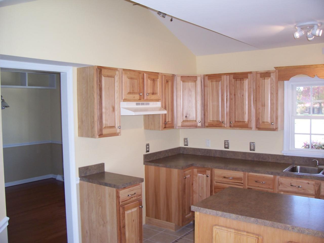 3852 Hatchett Road Penhook, VA 24137 - Photo 5 of 13 a kitchen with granite countertop a sink a stove and cabinets