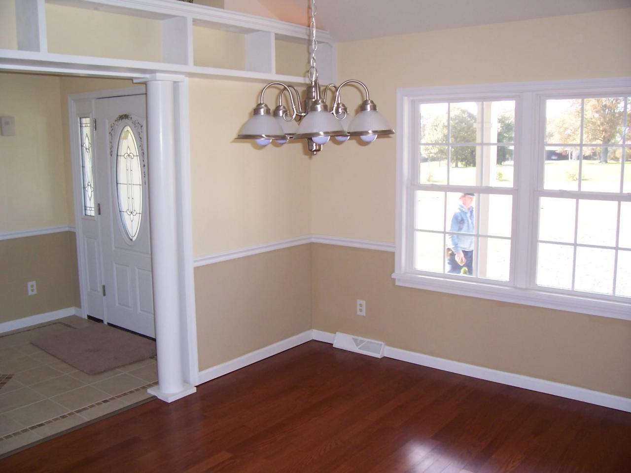 3852 Hatchett Road Penhook, VA 24137 - Photo 6 of 13 an empty room with wooden floor fan and windows