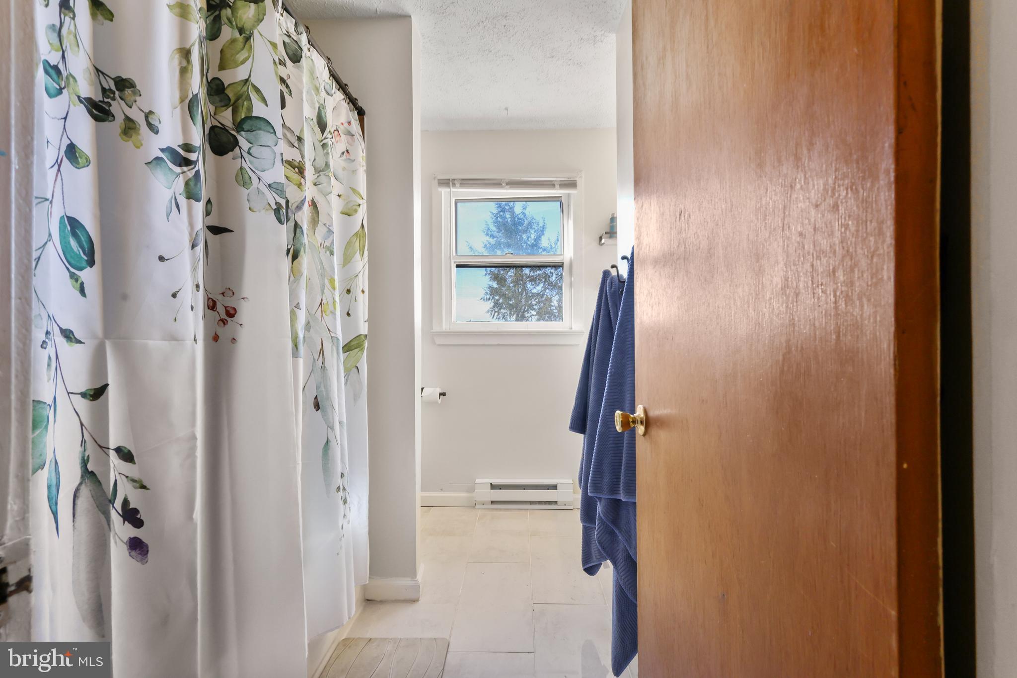 912 Arch Street Perkasie, PA 18944 - Photo 16 of 23 a bathroom with a shower