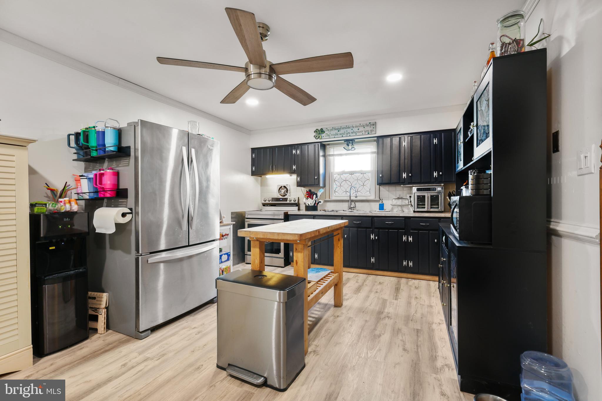 912 Arch Street Perkasie, PA 18944 - Photo 5 of 23 a kitchen with stainless steel appliances granite countertop a refrigerator a sink dishwasher a stove and a refrigerator