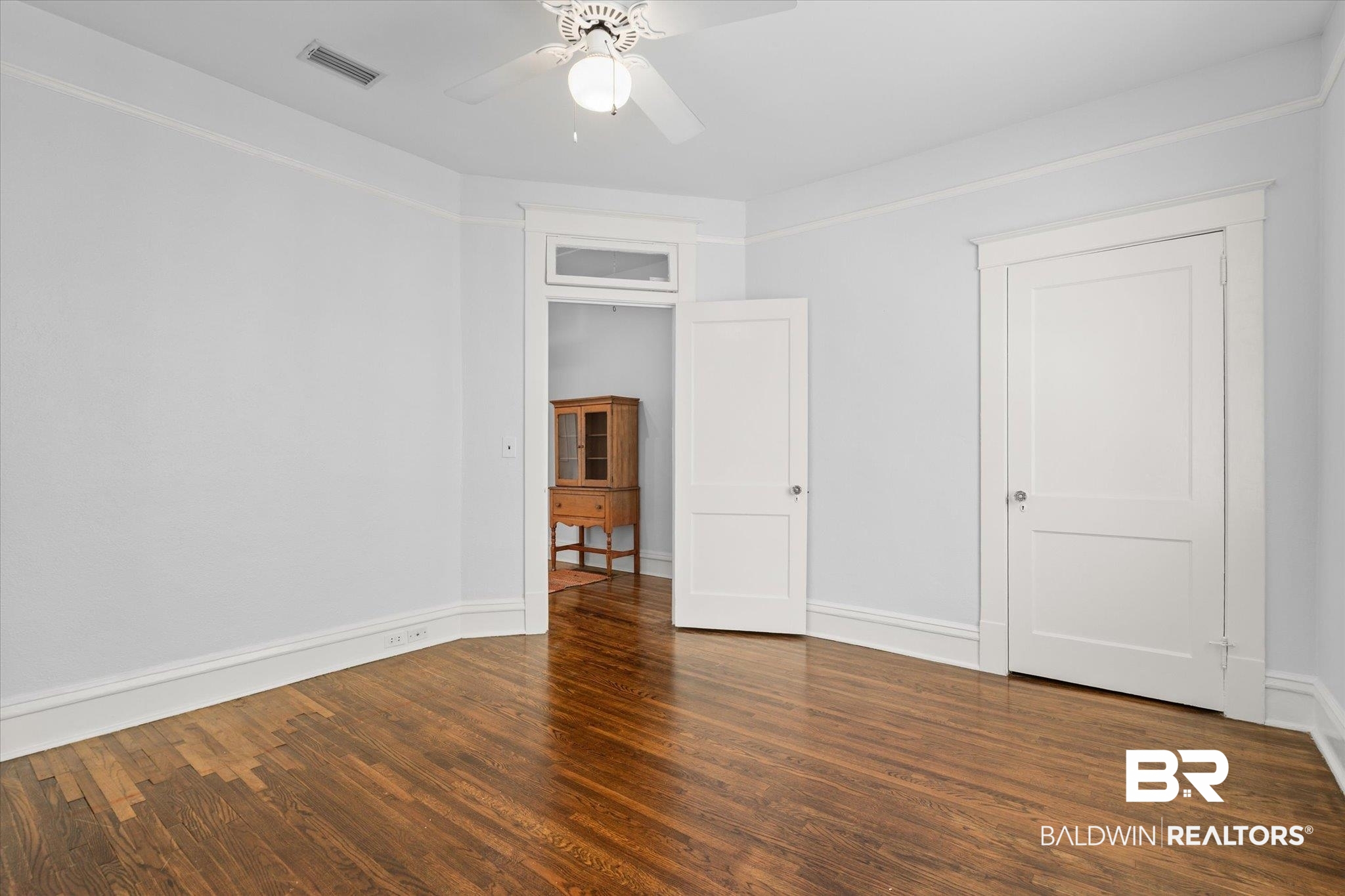 24 Macy Place Mobile, AL 36604 - Photo 24 of 38 Unfurnished bedroom with wood finished floors, baseboards, and ceiling fan