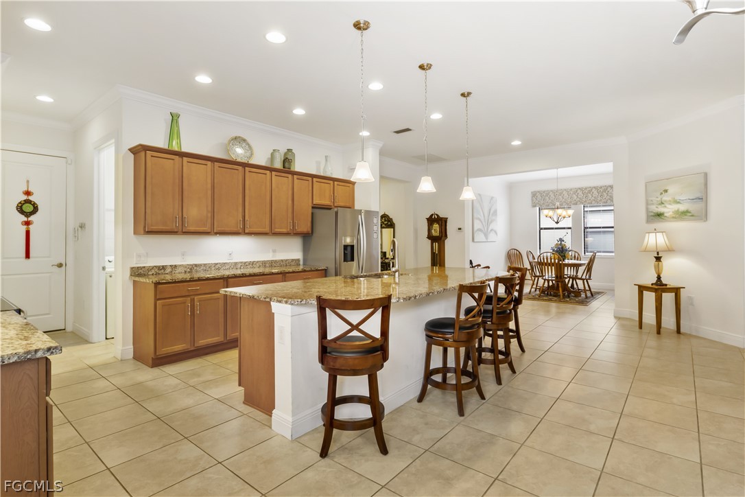 11767 Timbermarsh Court Fort Myers, FL 33913 - Photo 15 of 42 a large kitchen with a table and chairs