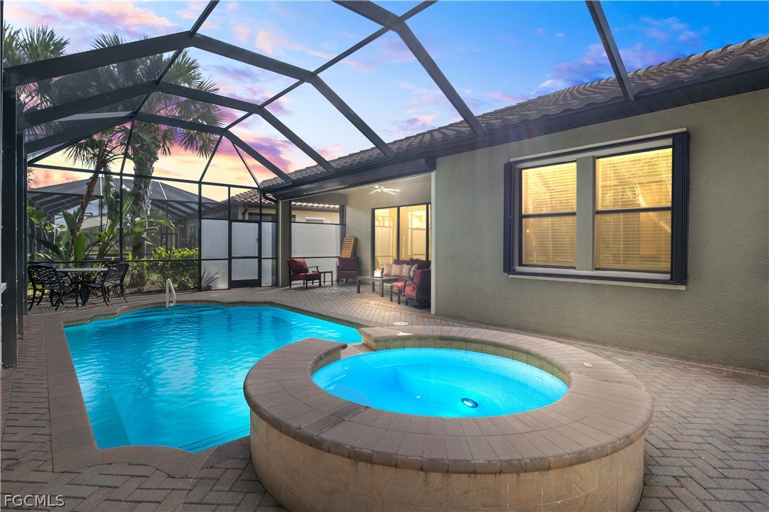 11767 Timbermarsh Court Fort Myers, FL 33913 - Photo 2 of 42 a view of a swimming pool with a patio