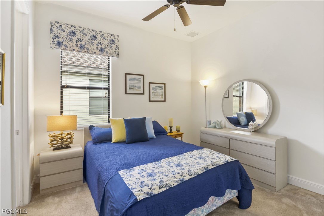 11767 Timbermarsh Court Fort Myers, FL 33913 - Photo 24 of 42 a bedroom with a large bed and a dresser