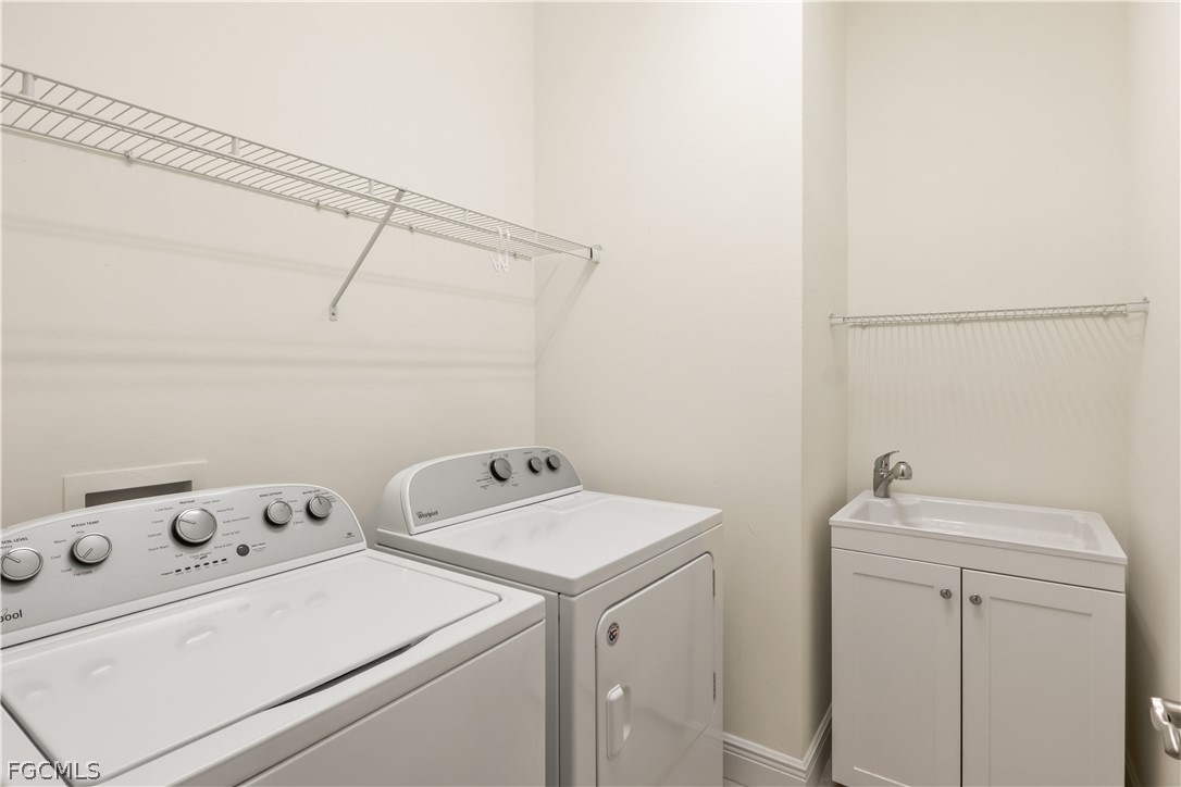 11767 Timbermarsh Court Fort Myers, FL 33913 - Photo 29 of 42 a utility room with dryer and washer