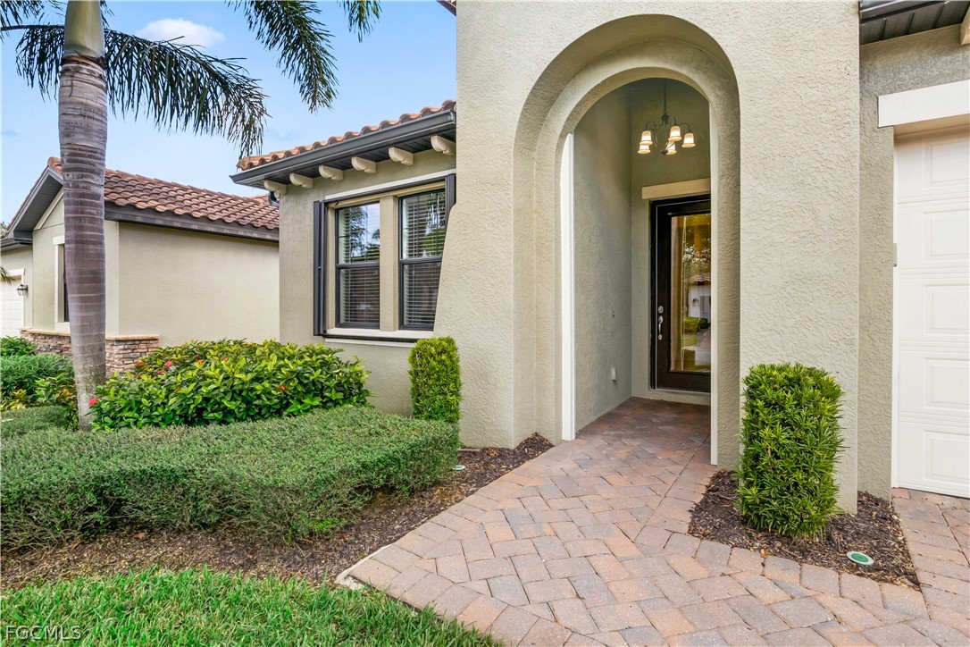 11767 Timbermarsh Court Fort Myers, FL 33913 - Photo 31 of 42 a front view of a house with a garden