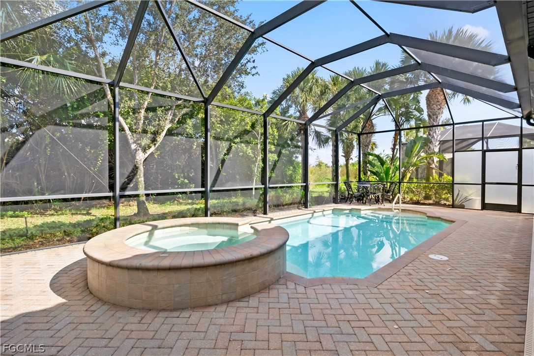 11767 Timbermarsh Court Fort Myers, FL 33913 - Photo 35 of 42 a view of a swimming pool with a patio