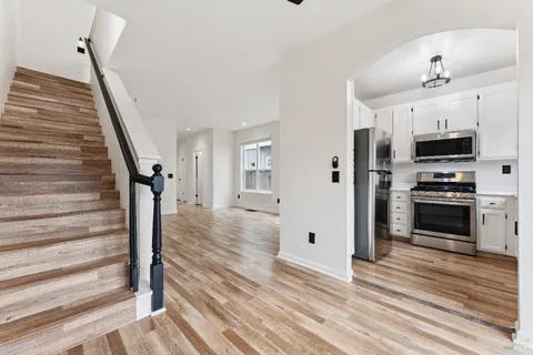 a view of a kitchen from the hallway