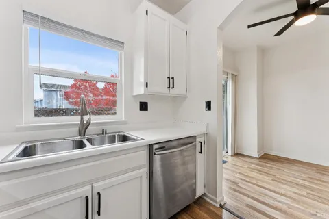 a kitchen with a sink and cabinets