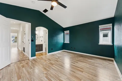 a view of a big room with closet and windows