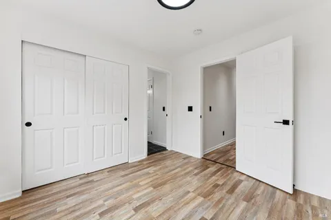 a view of a livingroom with wooden floor