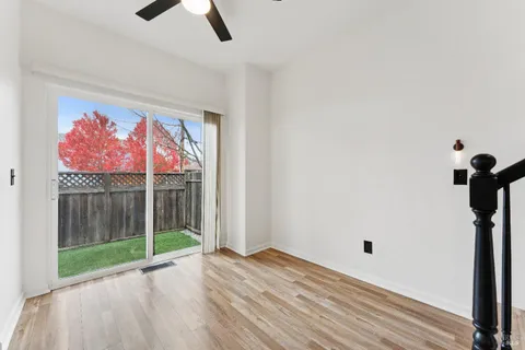 a view of empty room with floor to ceiling window